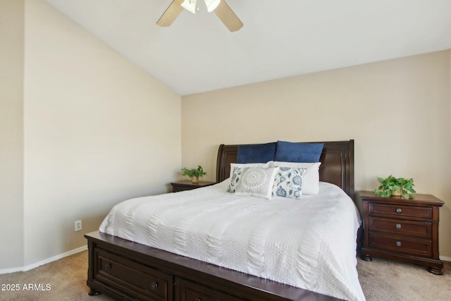 bedroom with ceiling fan, light carpet, and vaulted ceiling