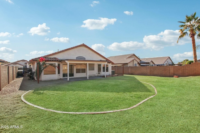 rear view of property featuring a yard