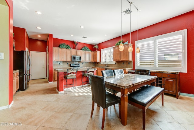 tiled dining room with sink