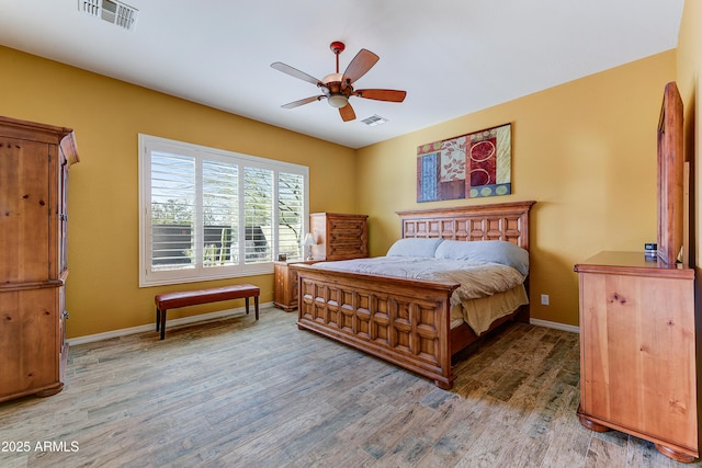 bedroom with hardwood / wood-style flooring and ceiling fan