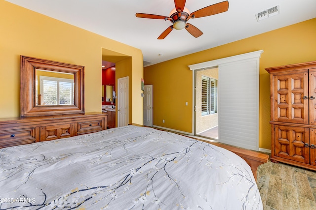 unfurnished bedroom featuring access to exterior, light hardwood / wood-style flooring, and ceiling fan