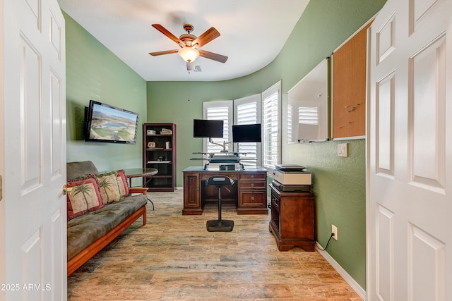 office space with ceiling fan and light hardwood / wood-style flooring