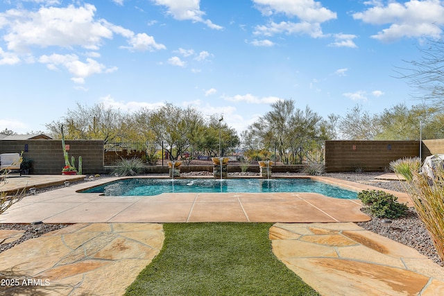 view of swimming pool featuring pool water feature and a patio area