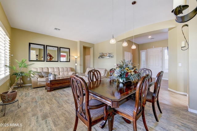 dining space featuring a wealth of natural light and light hardwood / wood-style floors