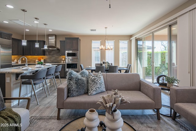 living room featuring an inviting chandelier