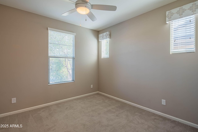 carpeted empty room with ceiling fan