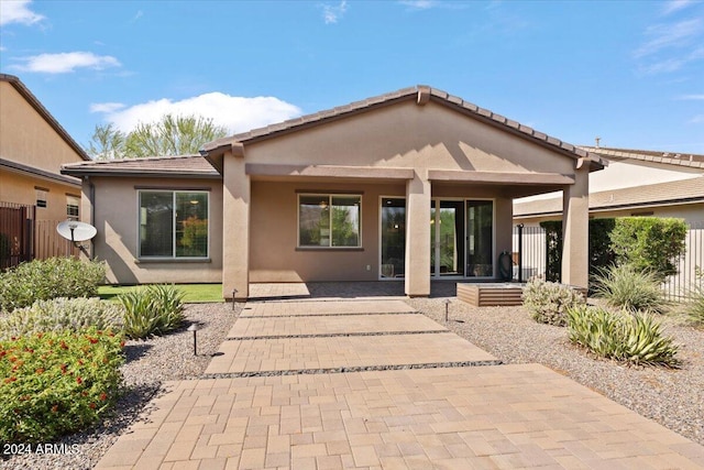 rear view of house with a patio area