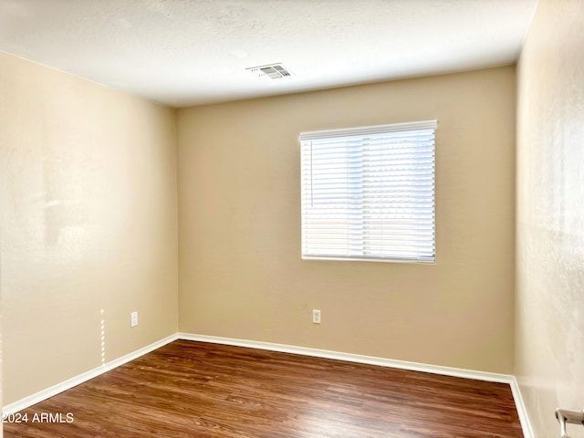 empty room with wood-type flooring