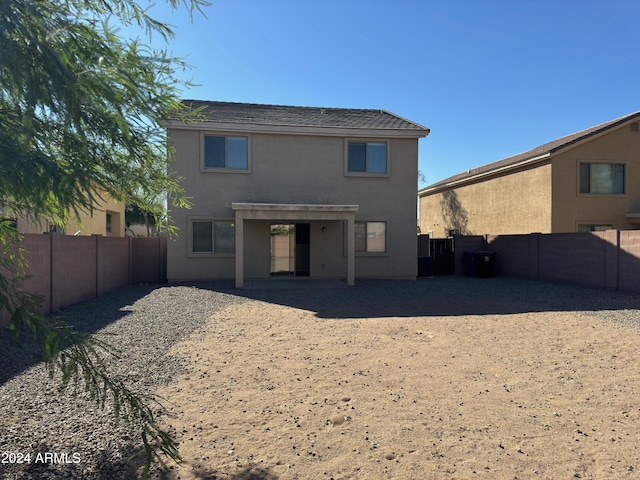 rear view of property featuring a patio