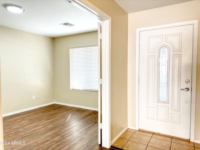 foyer entrance with light hardwood / wood-style flooring