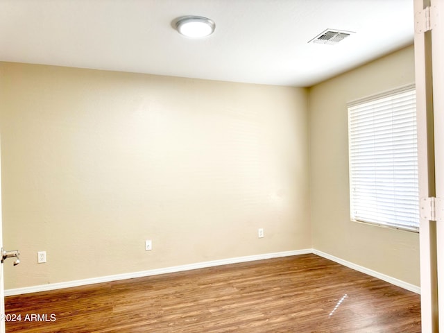 empty room featuring wood-type flooring