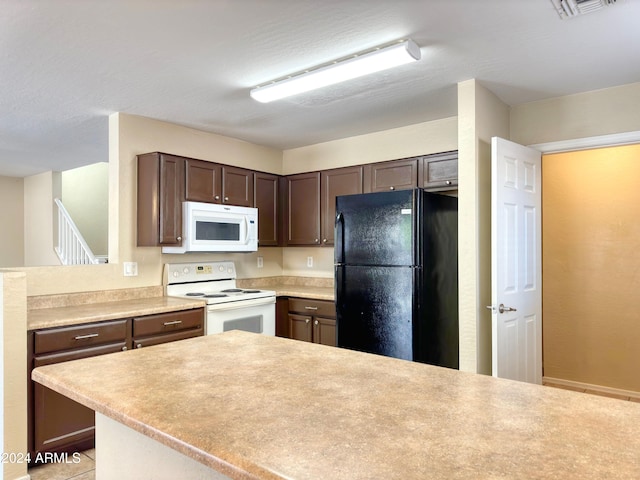 kitchen with dark brown cabinetry and white appliances