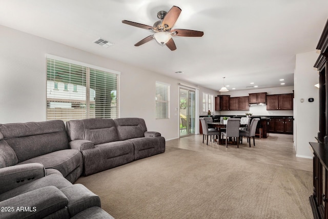 1876 E Azalea Ct, Gilbert, AZ 85298 - living area with ceiling fan, recessed lighting, baseboards, and light carpet