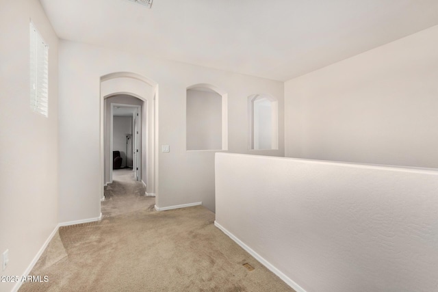 1876 E Azalea Ct, Gilbert, AZ 85298 - hallway featuring carpet floors, baseboards, and arched walkways