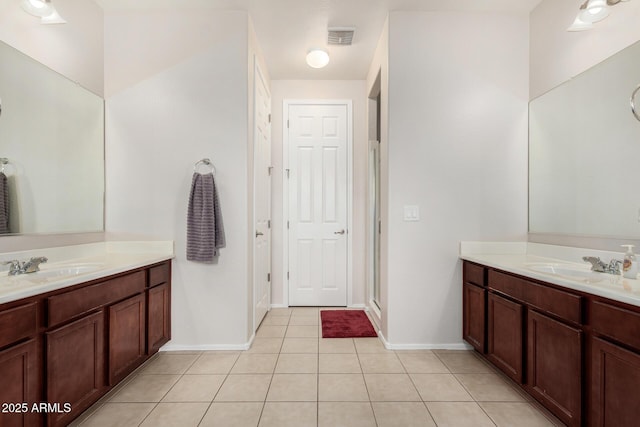 1876 E Azalea Ct, Gilbert, AZ 85298 - bathroom with tile patterned flooring, two vanities, baseboards, and a shower with shower door