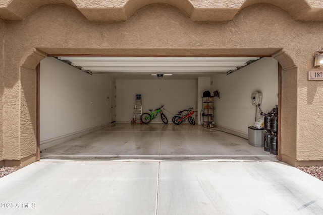 1876 E Azalea Ct, Gilbert, AZ 85298 - garage featuring driveway and a garage door opener