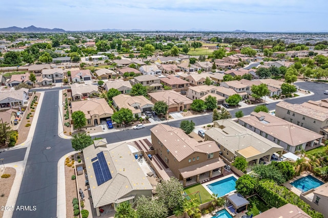 1876 E Azalea Ct, Gilbert, AZ 85298 - aerial view of residential area with a pool area and a mountain backdrop