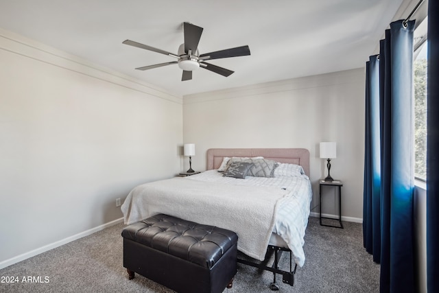 carpeted bedroom with multiple windows, ceiling fan, and crown molding