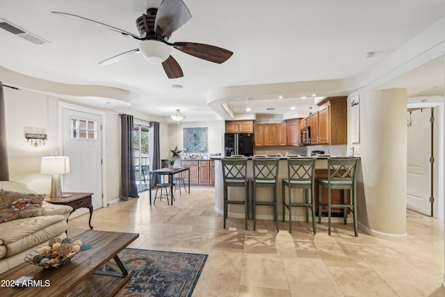 interior space featuring ceiling fan