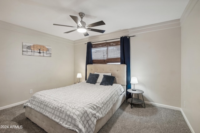 carpeted bedroom with ornamental molding and ceiling fan