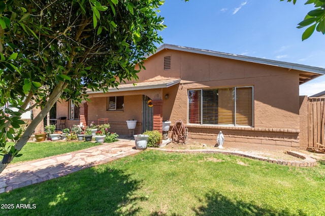 2207 N 53rd Ave, Phoenix, AZ 85035 - view of front facade with stucco siding and a front lawn