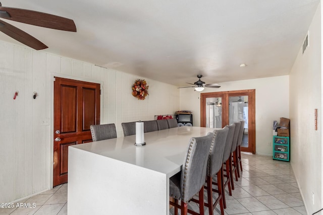2207 N 53rd Ave, Phoenix, AZ 85035 - dining space featuring light tile patterned floors, ceiling fan, and visible vents