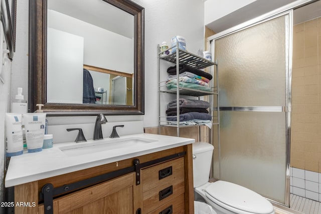 2207 N 53rd Ave, Phoenix, AZ 85035 - bathroom with vanity, a stall shower, and toilet