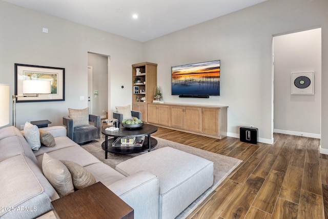 living room featuring recessed lighting, dark wood finished floors, and baseboards