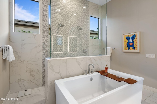 full bath with marble finish floor, a soaking tub, and walk in shower