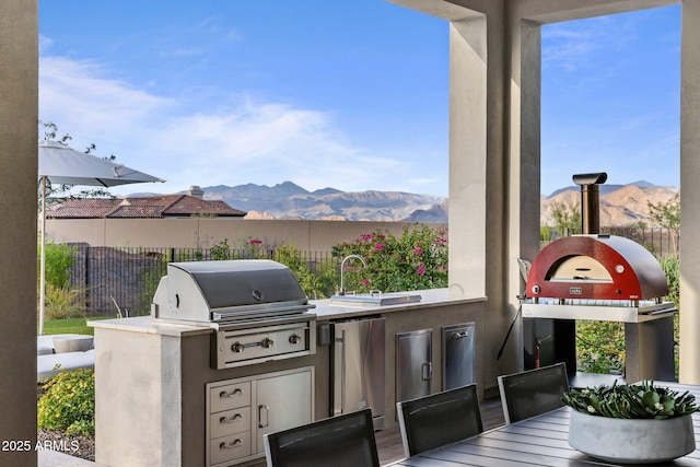 view of patio featuring an outdoor kitchen and grilling area