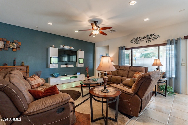 tiled living room with ceiling fan