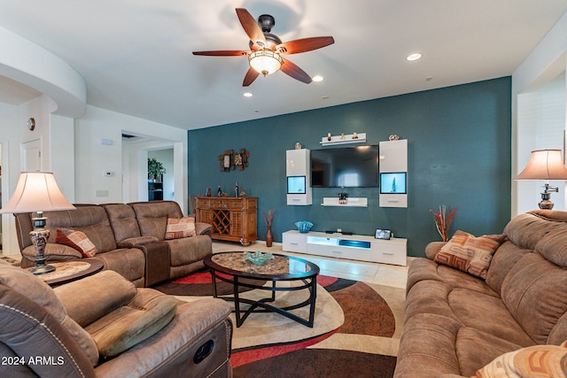 tiled living room with ceiling fan