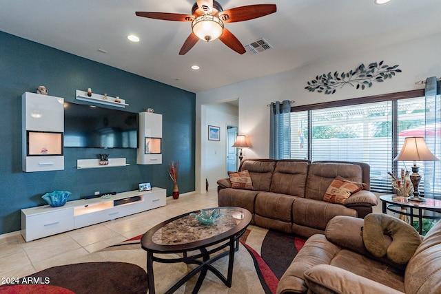 living room with light tile patterned floors and ceiling fan