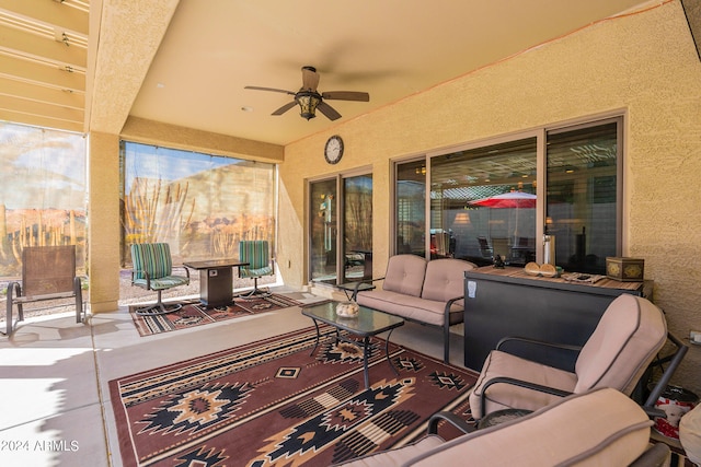 view of patio featuring an outdoor hangout area and ceiling fan