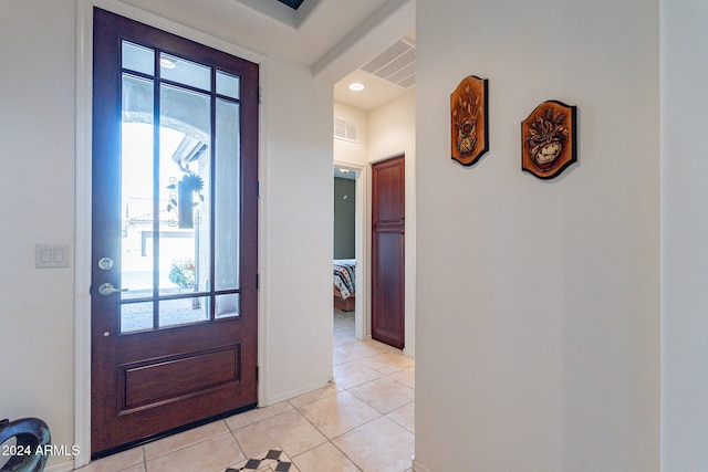 tiled foyer with plenty of natural light