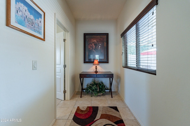 corridor with light tile patterned flooring