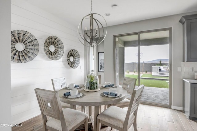 dining area featuring an inviting chandelier