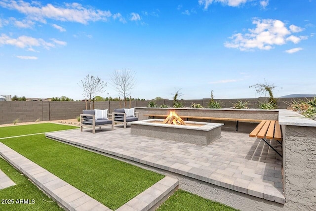 view of patio with an outdoor fire pit