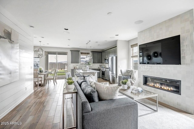 living room with a tiled fireplace