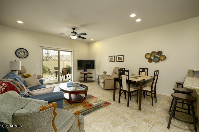 living area featuring recessed lighting, a ceiling fan, and light tile patterned floors