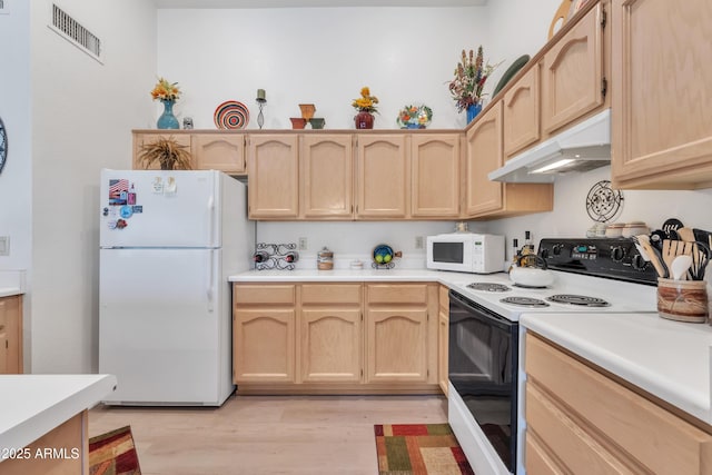 kitchen with white appliances, light hardwood / wood-style flooring, and light brown cabinets