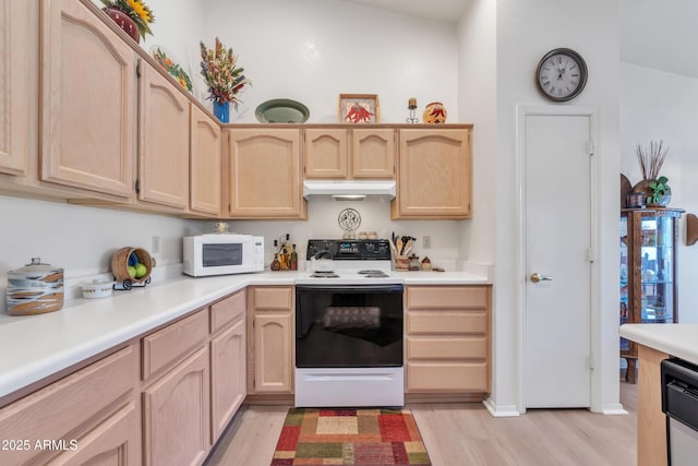 kitchen featuring light brown cabinets, white appliances, and light hardwood / wood-style flooring