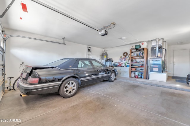 garage with a garage door opener and water heater