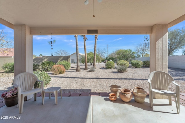 view of patio featuring ceiling fan