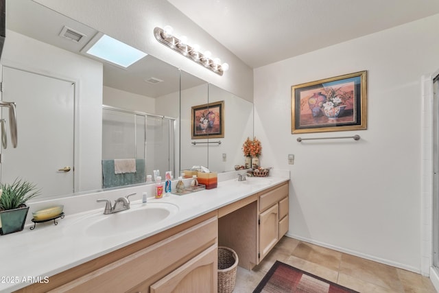 bathroom featuring walk in shower, tile patterned floors, and vanity