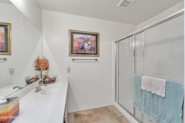 bathroom featuring walk in shower, tile patterned floors, and vanity