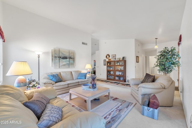 living room featuring vaulted ceiling and light colored carpet