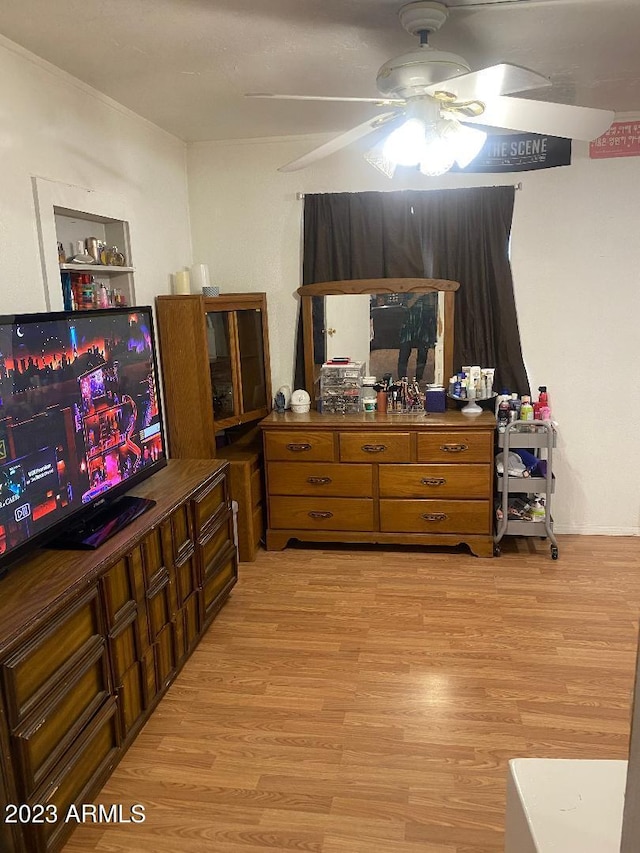 bedroom with ceiling fan and light hardwood / wood-style flooring