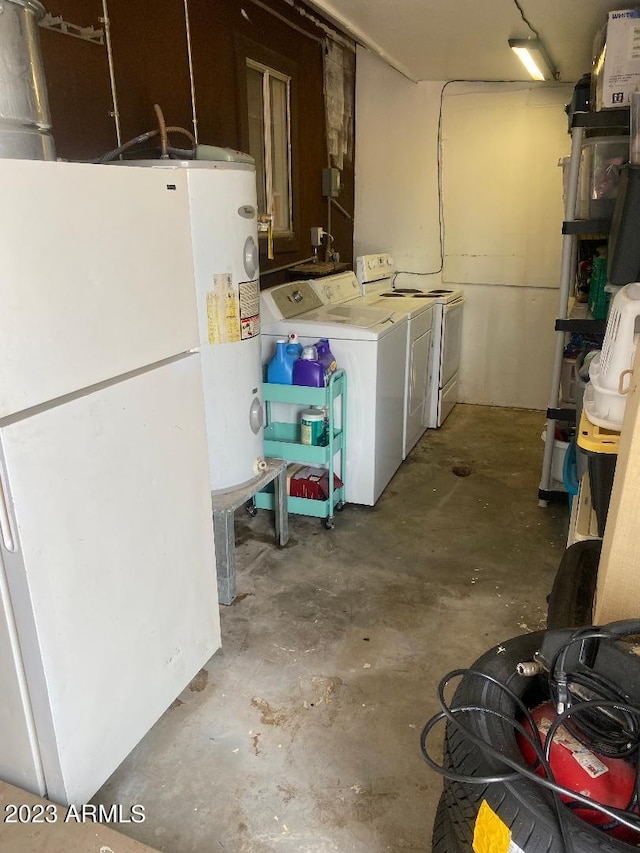 basement featuring white fridge and independent washer and dryer