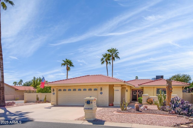 25850 S Foxglenn Dr, Sun Lakes, AZ 85248 - view of front of home with stucco siding, driveway, a tile roof, and an attached garage